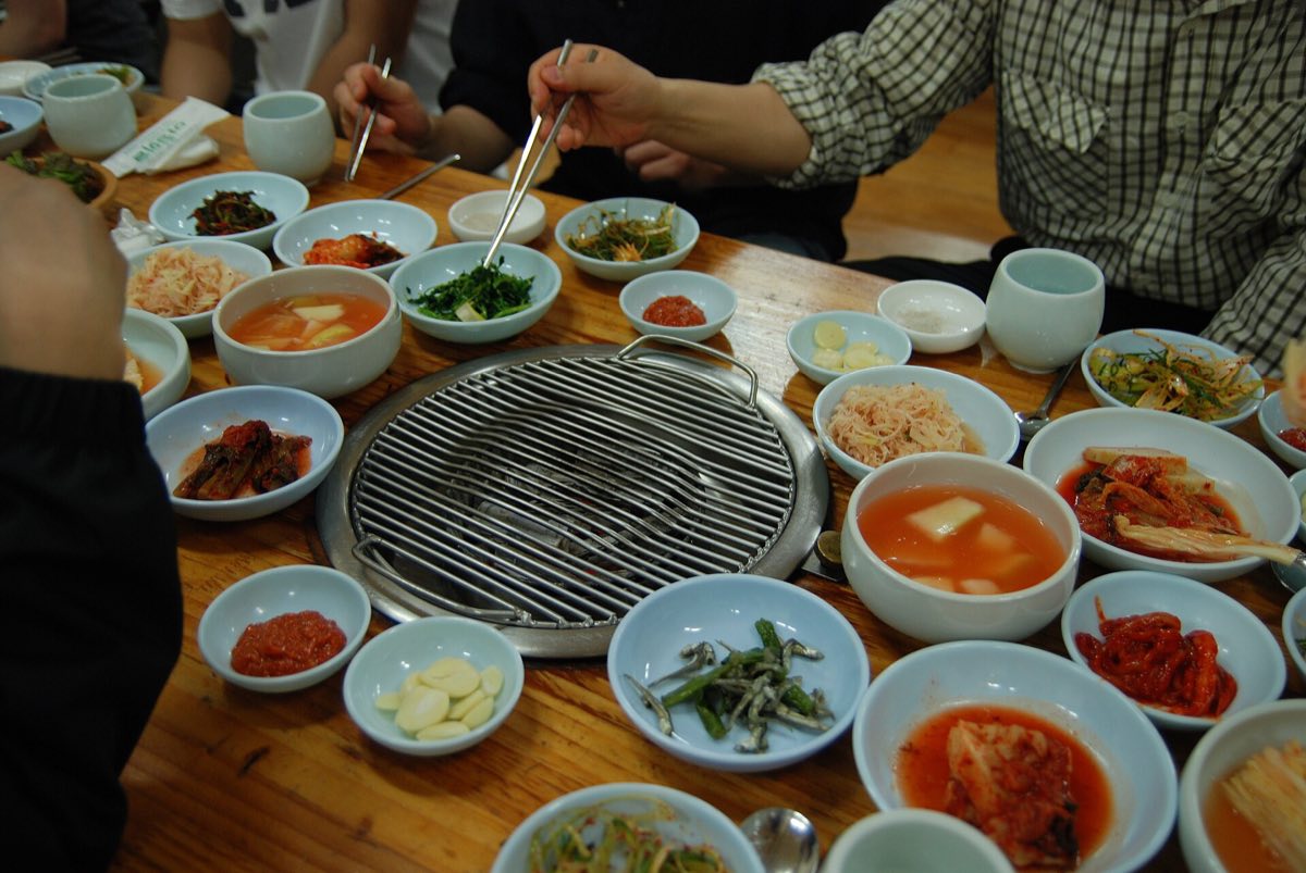 A Korean barbecue grill and banchan — representative of the cuisine, not a photo of any restaurant on this list